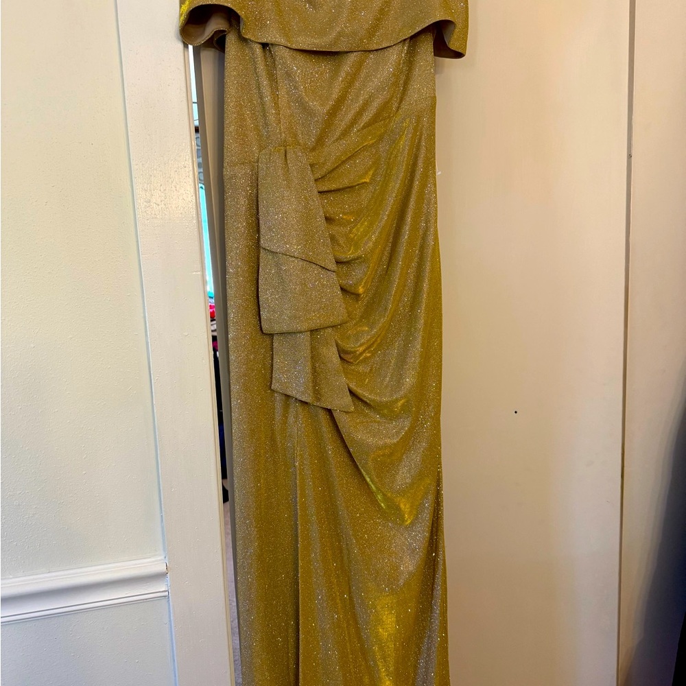 Gorgeous off the shoulder gold metallic formal dress.New without tags